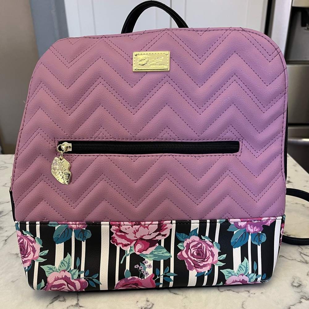 NWOT Betsey Johnson purple and floral backpack. Perfect condition!!!